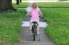 640px-Girl_on_bike_training_wheels.jpg